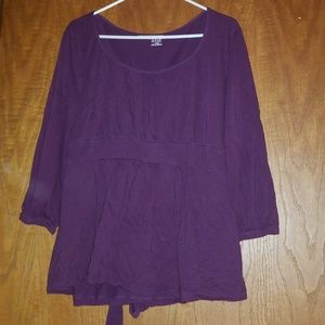 Purple tie behind shirt